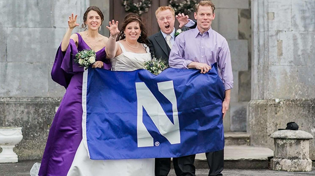 Leslie and Tony Wrenn posing with Northwestern Flag