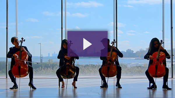 Four students playing instruments