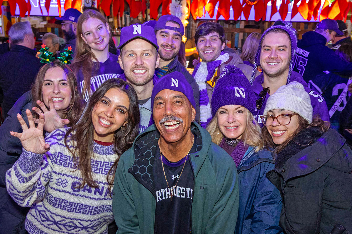Northwestern fans posing for a picture at GameAbove Sports Bowl