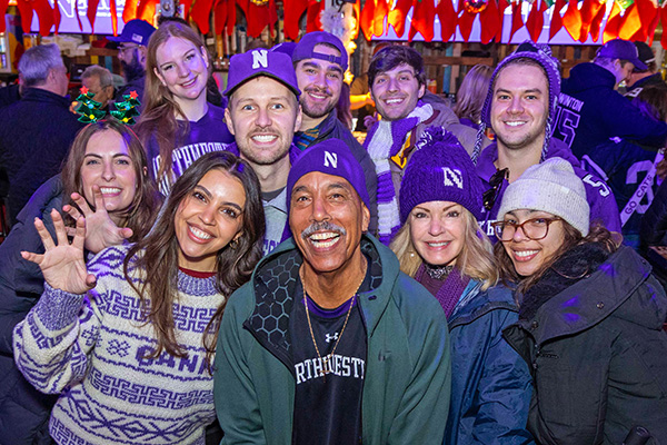 Northwestern fans posing for a picture at GameAbove Sports Bowl